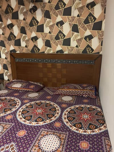 wooden bed with dressing table