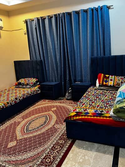 Two single bed sets with side tables