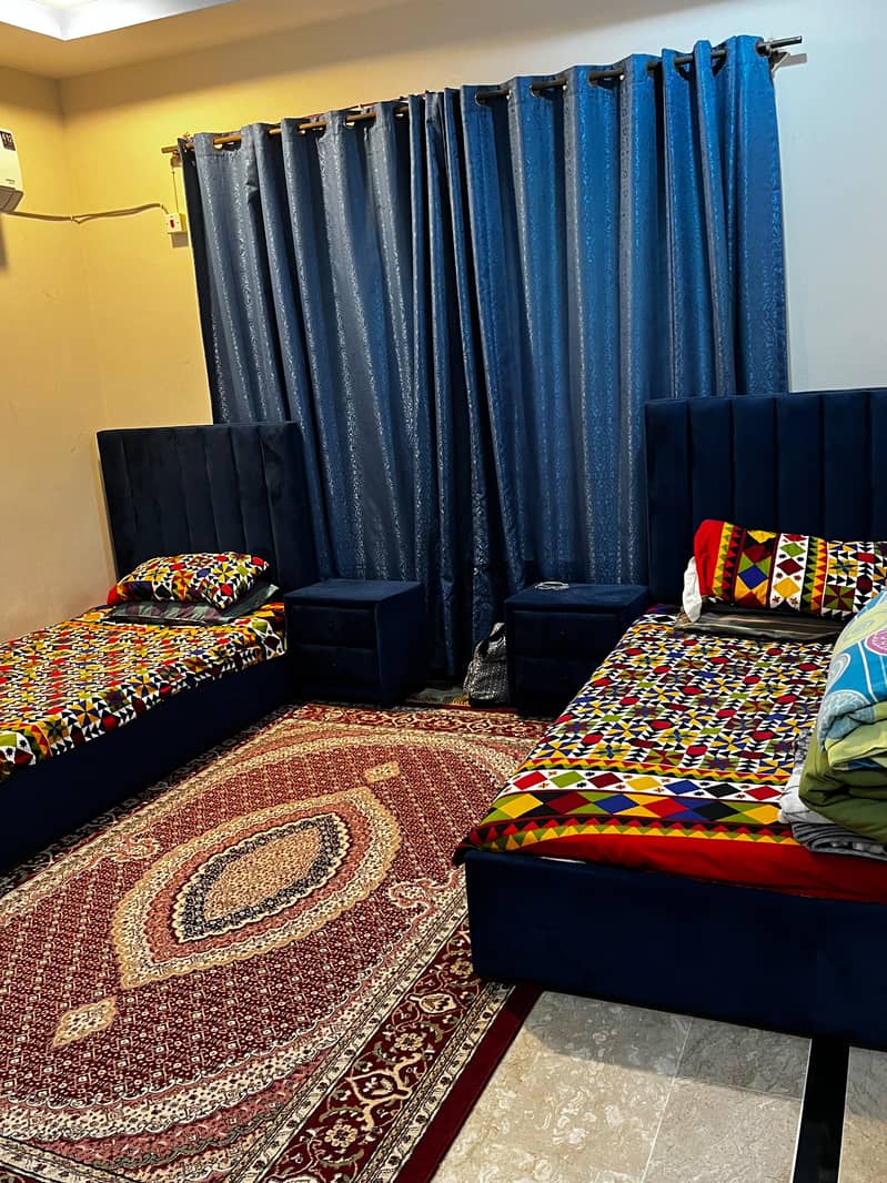 Two single bed sets with side tables 0