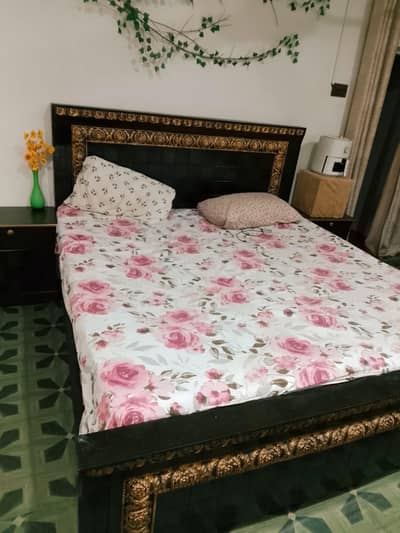 bed with side tables and dressing table