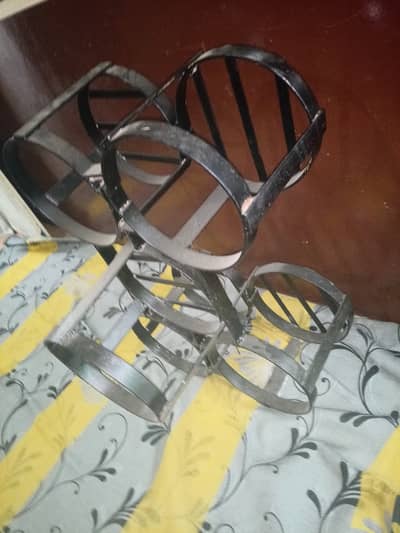 Iron stand for supplies bottles