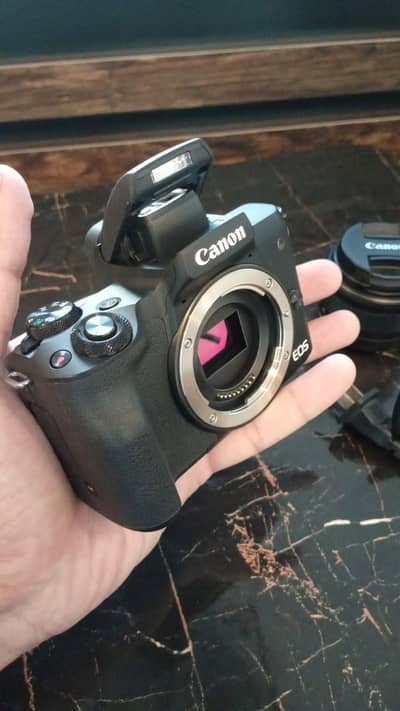 Canon EOS M50 with 15-45 MM Lens, 3 Batteries and Bag