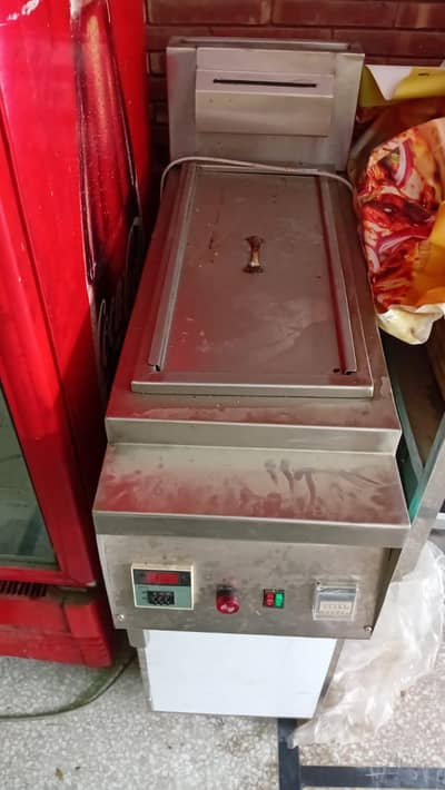 brand new fryer and fridge tables