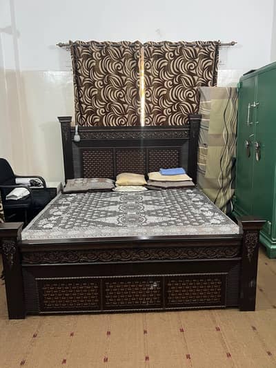 King size bed with side table