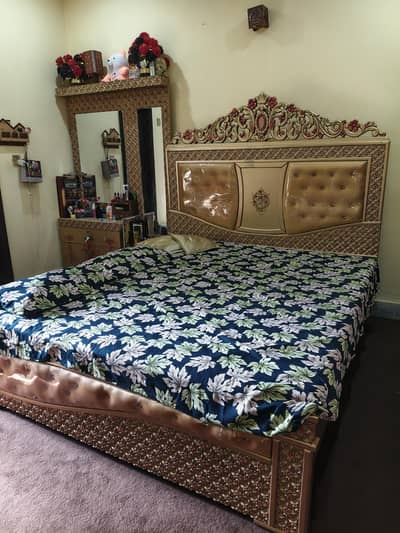 bed with side table, dressing table and showcase