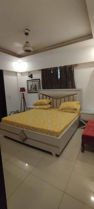 wooden bed with 2 side tables
