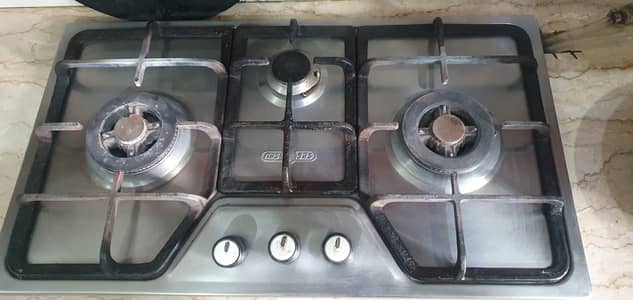 stove with two large burners and 1 small burner