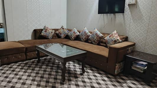 L shape sofa with table and stools
