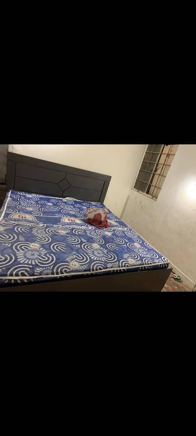 king size bed and three door almari
