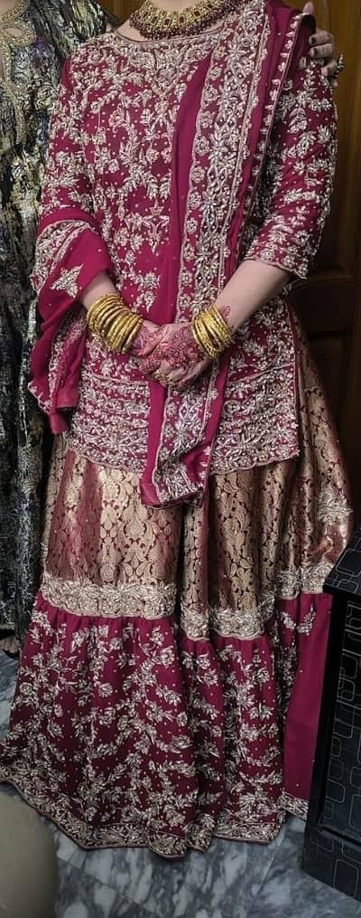 Red Embroidered lehnga with Pouch