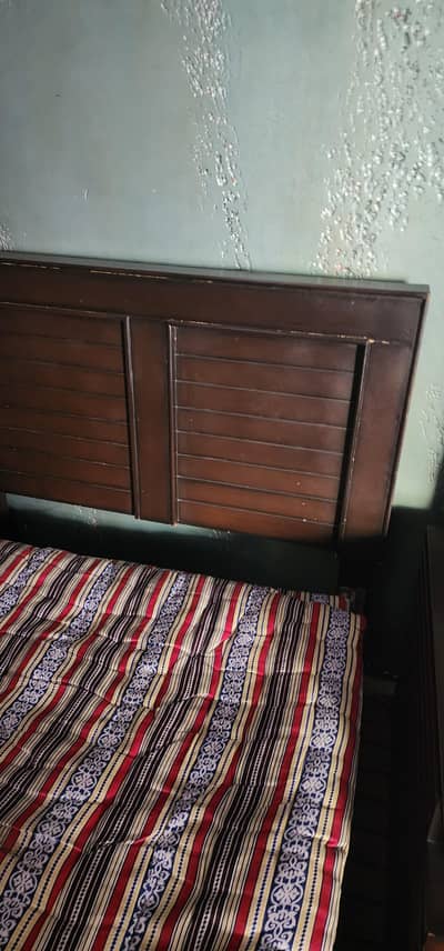 2 single wooden bed