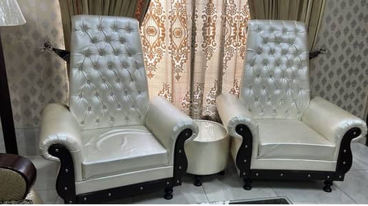 2 seater  sofa chairs with a table
