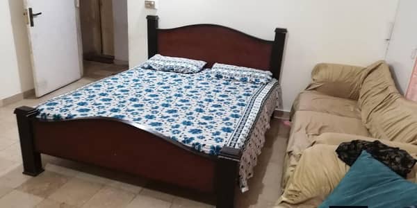 wooden bed with mattress
