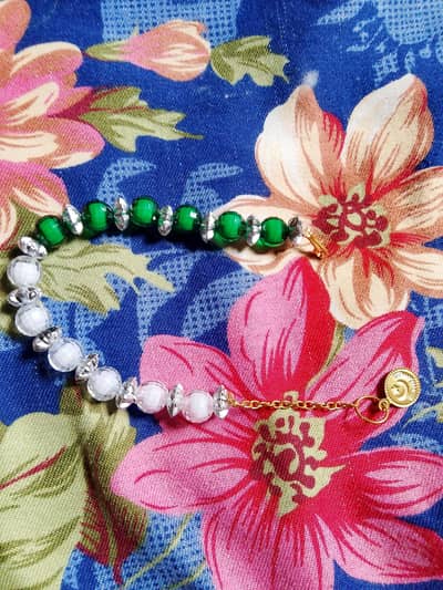Beautiful green and white color bracelets for 14 August