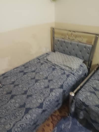 Two single beds with two brand new mattresses Like new condition