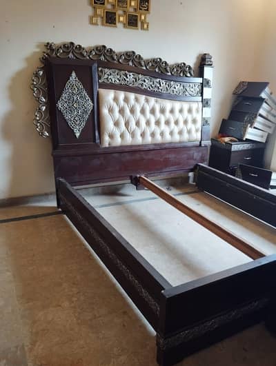 king size double bed with side tables and dressing table