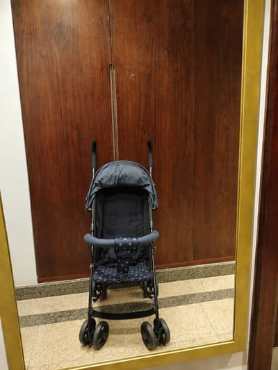 Stroller and red toy car