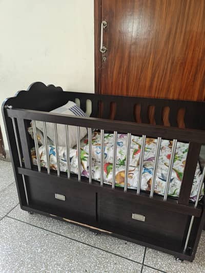 Kids cot and drawer for sale.