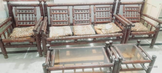 a wooden sofa set