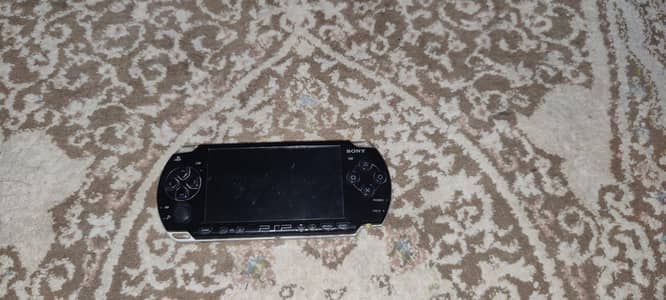 PSP 2003 Model with 1GB stick battery and charger.
