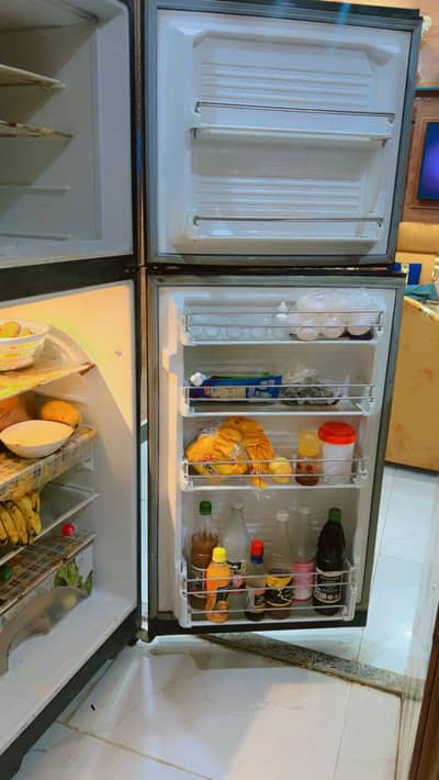 Medium size black color fridge contact on wtsp only