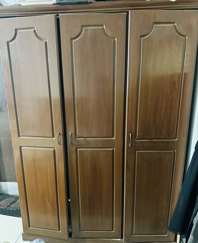 Wooden three door cupboard