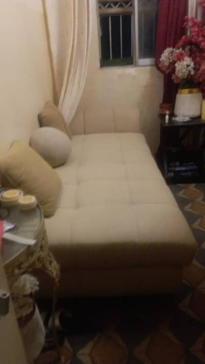 single bed with cushions