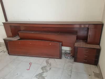 wooden bed with back and side drawers