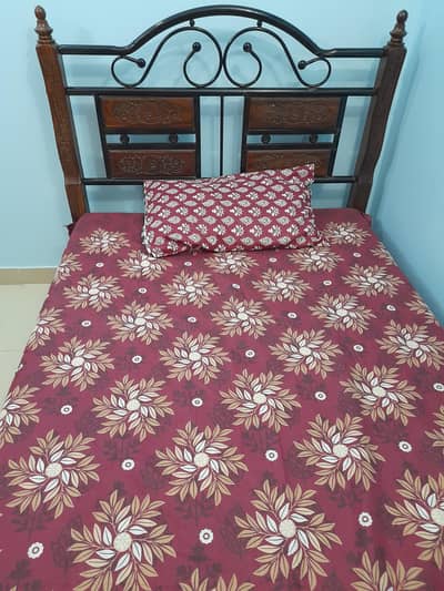 Iron & wooden combination single bed with mattress .