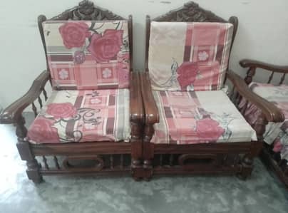 Sofa bunch set with cushions and one table.