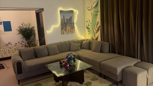 L shaped Sofa with center table and 4 stools