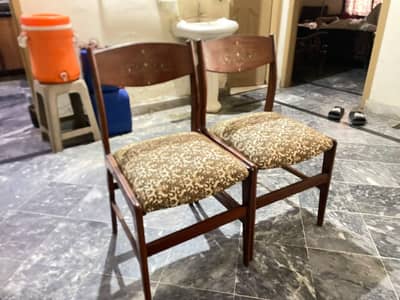 six wooden chairs