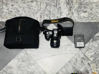 Nikon d5300 body with 50mm F1.8G Nikon prime lens and accessories.