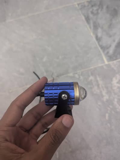 Motorcycle headlight/fog light in metal body