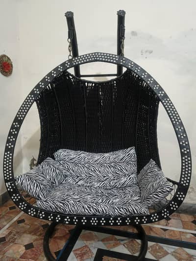 Premium hanging swing with soft cushions. Strong frame, Modern design.