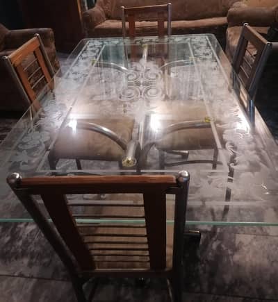 A complete dining set along with 6 chairs