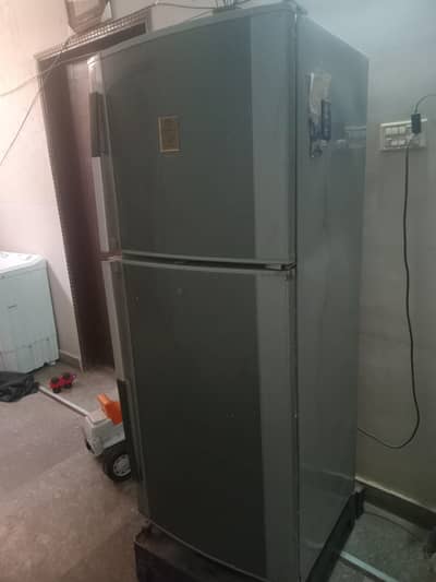 dawlance full size refrigerator in dark gray color 10 on 10 condition