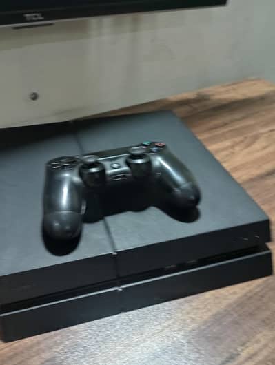 PS4 with four disc games two original controller and box