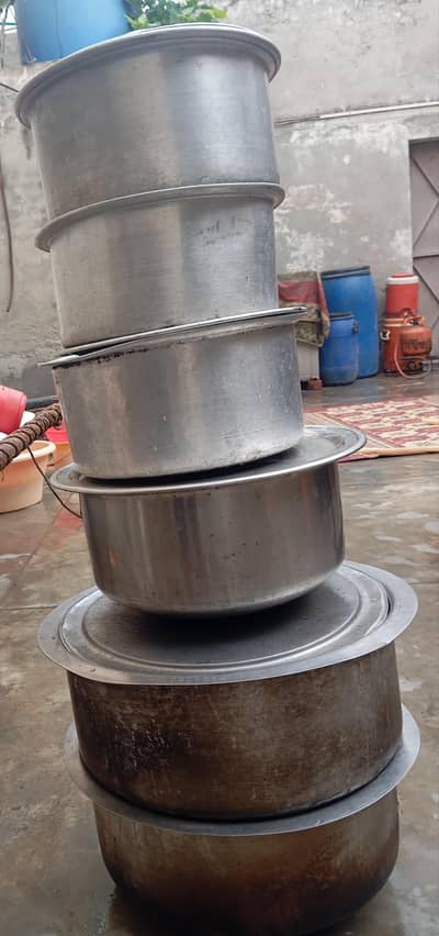 silver and steel pots