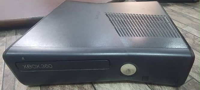 Xbox 360 slim with one controller and 78 games pre installed with box