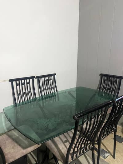 Wrought Iron Dining table with glass top and six chairs