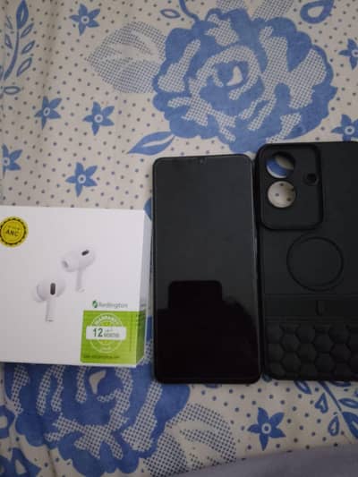 Realme Note 60x with cover and airbuds