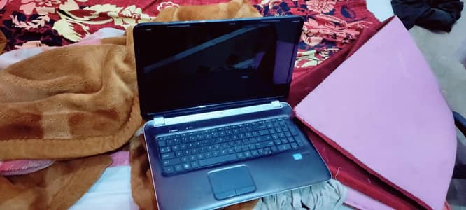 budget laptop for sale with charger and cooling pad