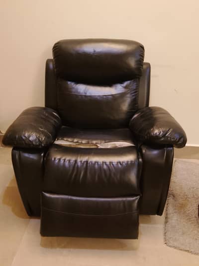 black reclining chair with plug