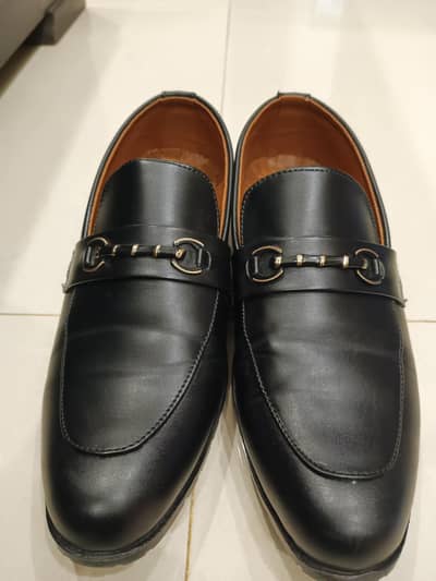 Pair of black leather loafers