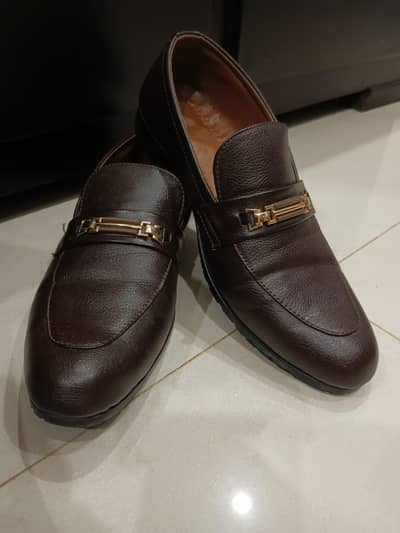 Pair of dark brown slip-on loafers