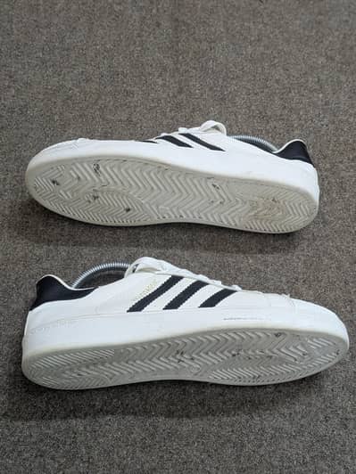 classic white Adidas Superstar sneakers