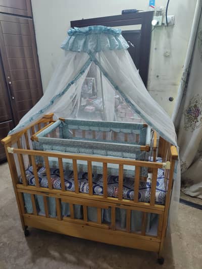 wooden baby cot with swing