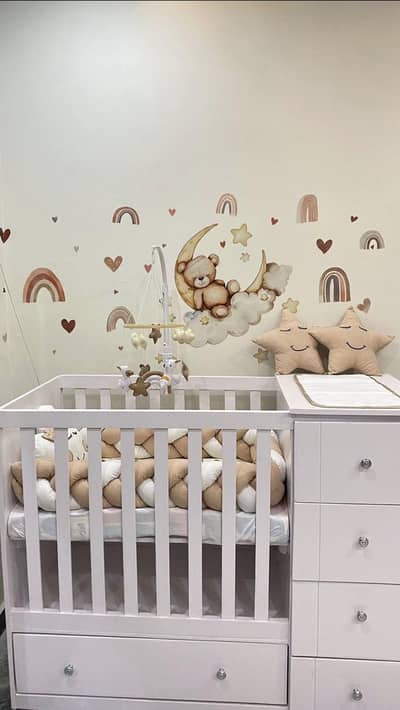 Wooden baby cot with alot of storage and mattress