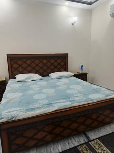 king size bed and side tables. without mattress